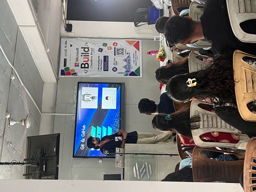 The full MS Build Bhopal crowd — three BUILD screens glowing as energy fills the room.